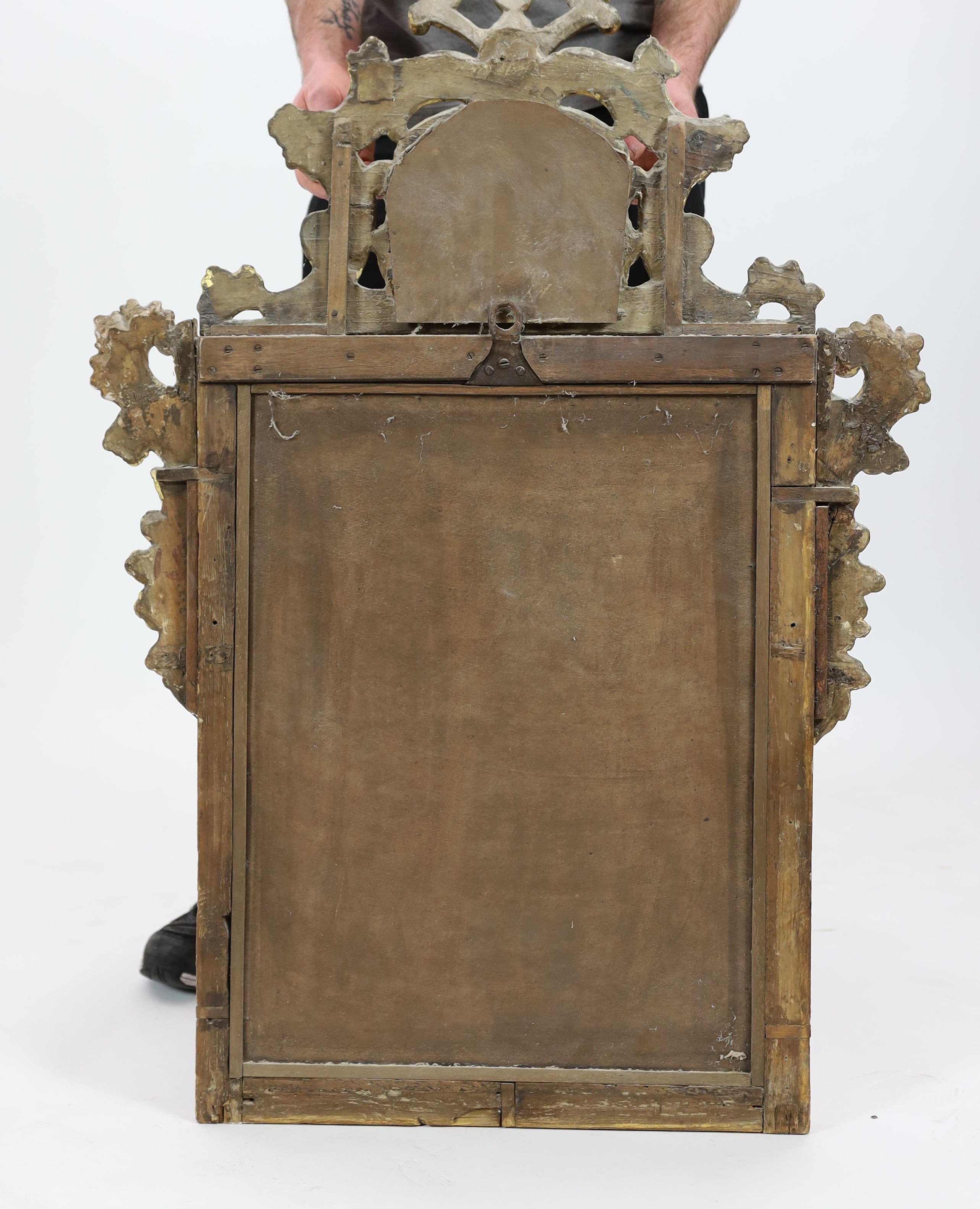 A George I carved giltwood wall mirror, W.71cm H.105cm